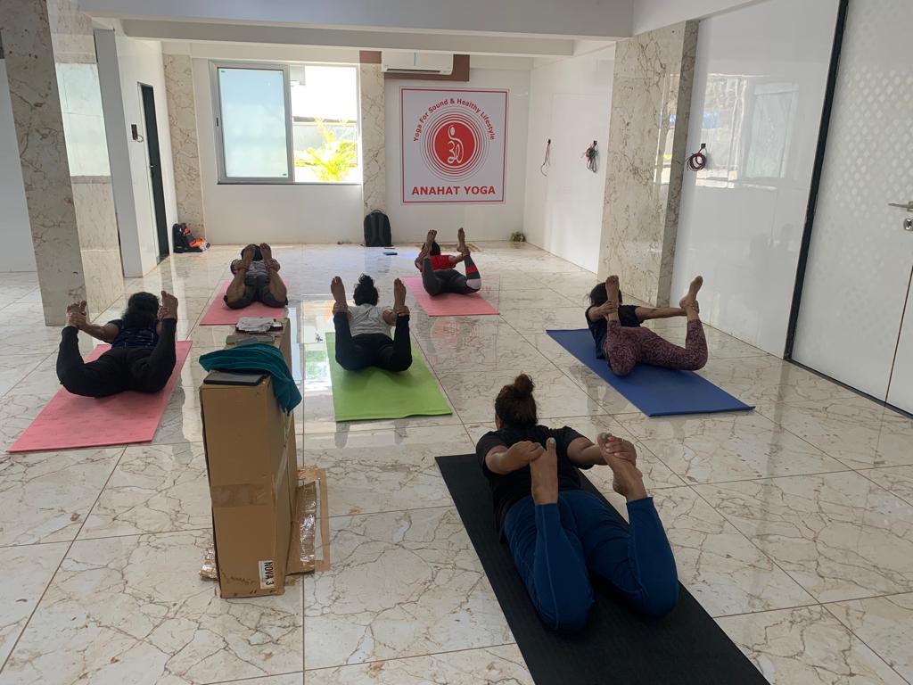 Yoga instructor guiding students in Pune